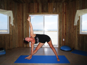 guest doing yoga in the exercise room